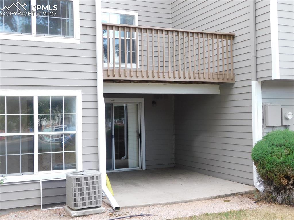 Image 18 of 48: View of exterior entry with a patio