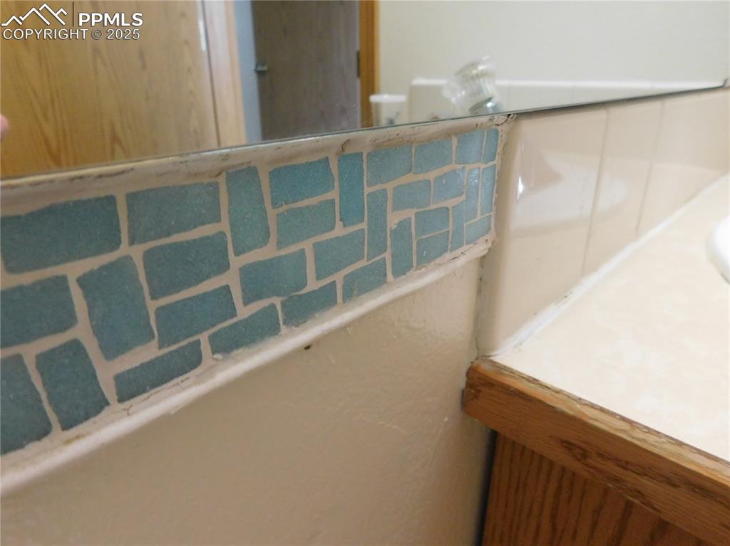 Image 32 of 48: mosiac tile in the bathroom