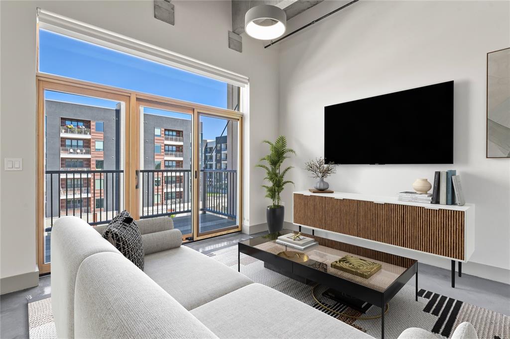 Image 4 of 22: Walk-out to private balcony. Virtually Staged.