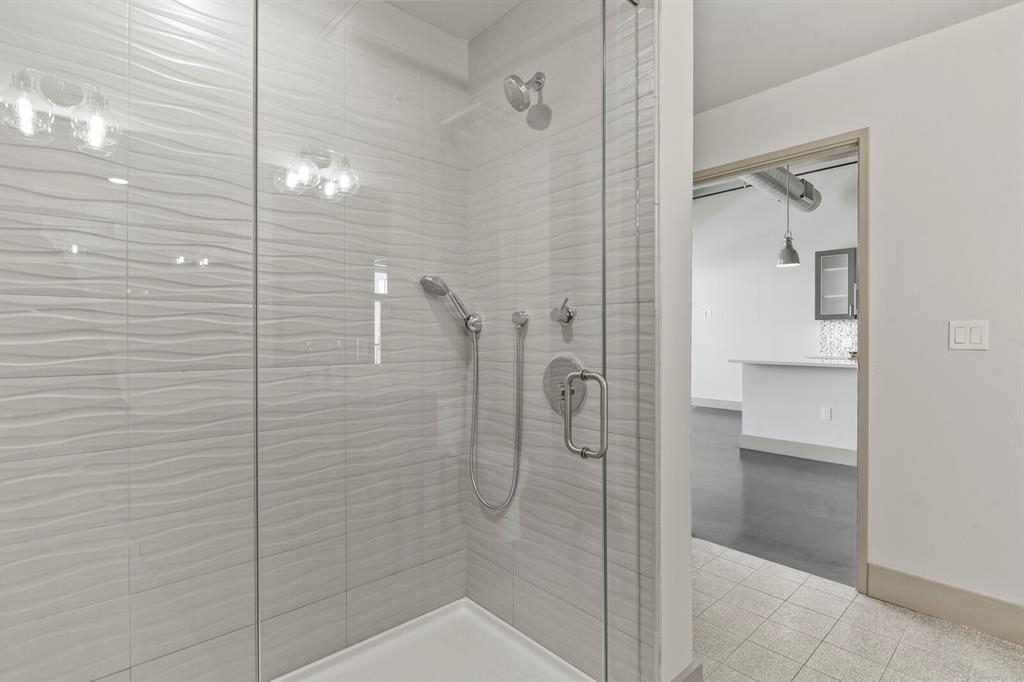 Image 9 of 22: Huge walk-in shower with frameless glass door