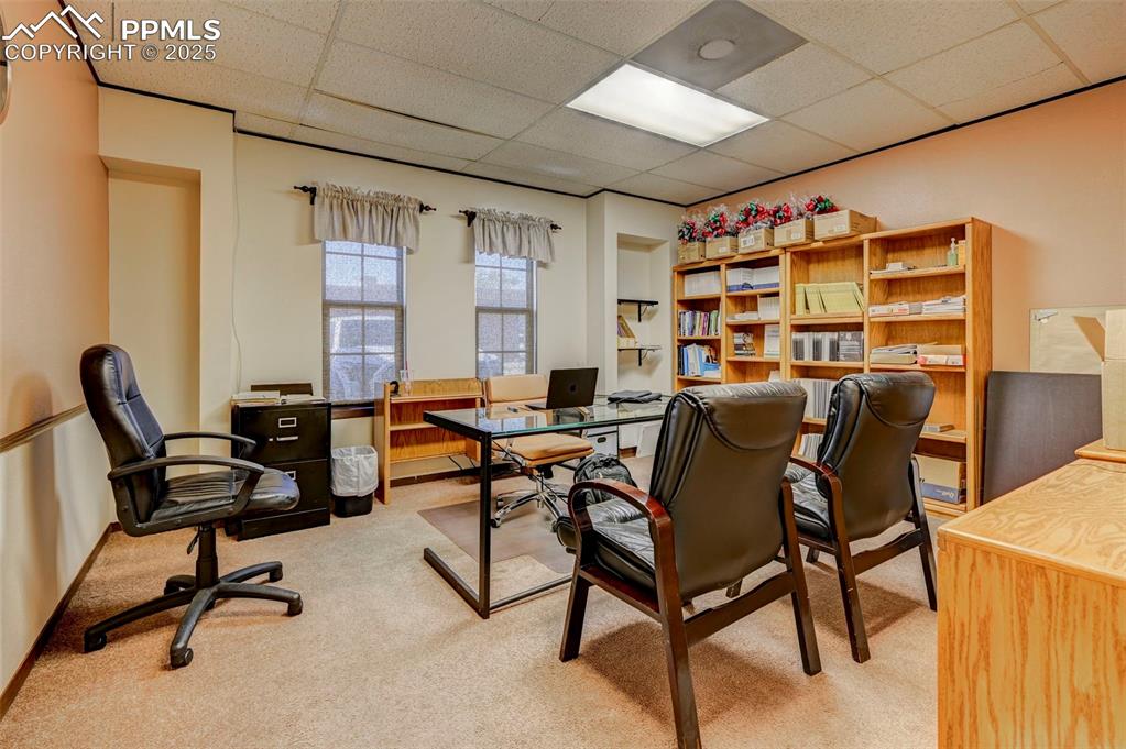 Image 26 of 45: Carpeted office featuring a drop ceiling