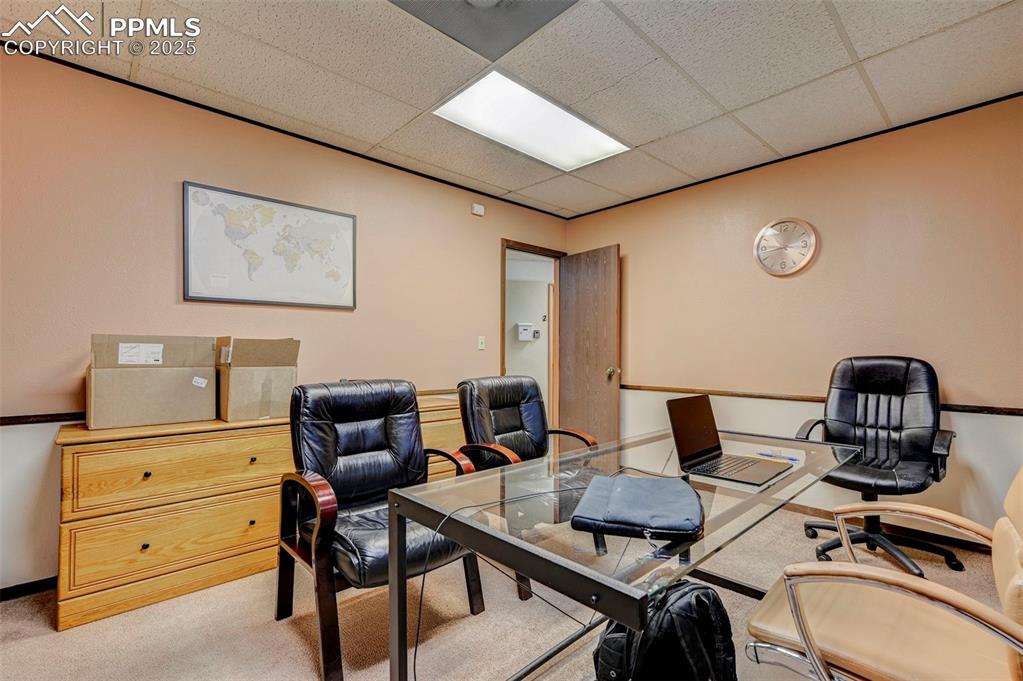 Image 27 of 45: Carpeted office featuring a drop ceiling