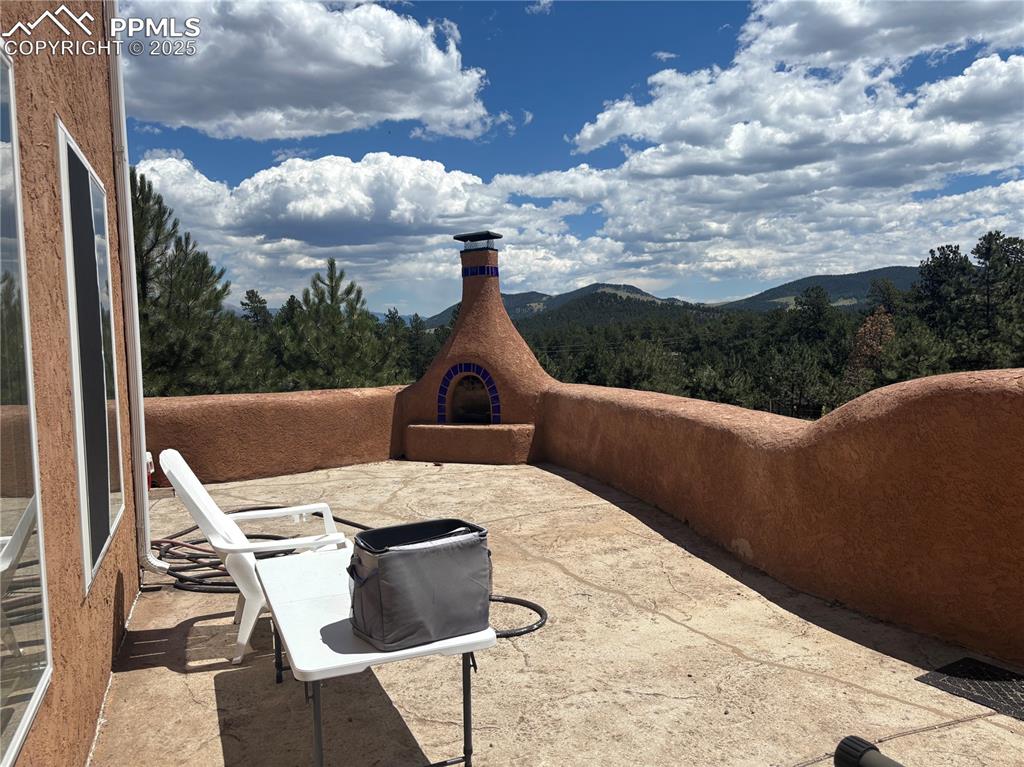 Image 19 of 25: View of patio featuring a mountain view