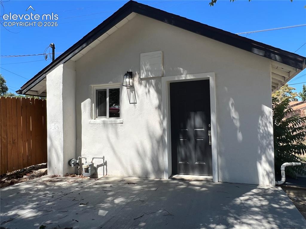 Image 14 of 23: Cottage exterior. Cottage has a separately fenced yard. 
