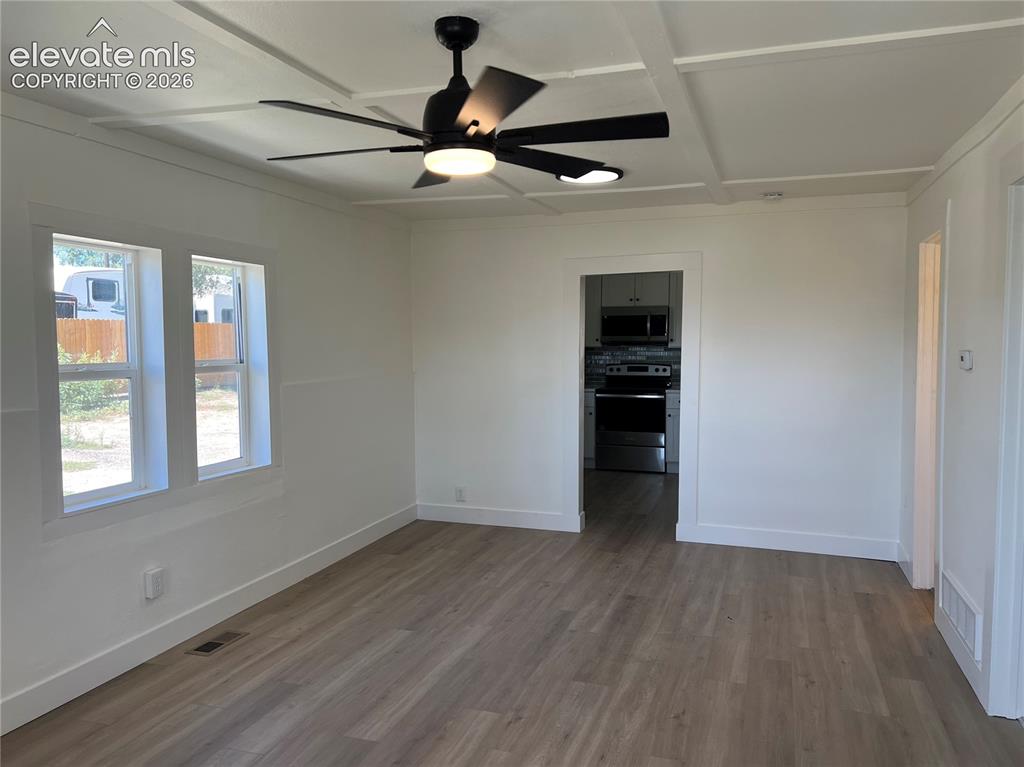 Image 5 of 23: Main House - Living room with luxury vinyl plank floors