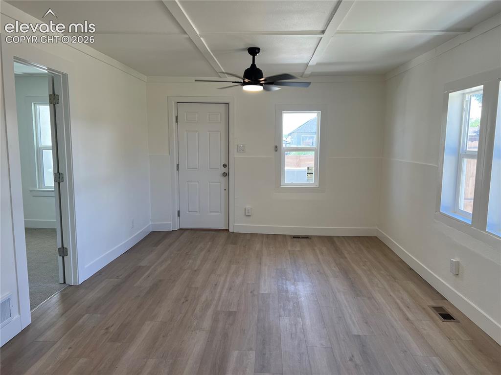 Image 6 of 23: Main House - Living room with luxury vinyl plank floors