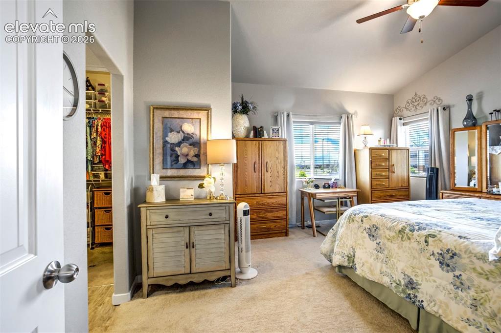 Image 19 of 43: Attached bathroom with walk in shower and large closet with crawl space acc