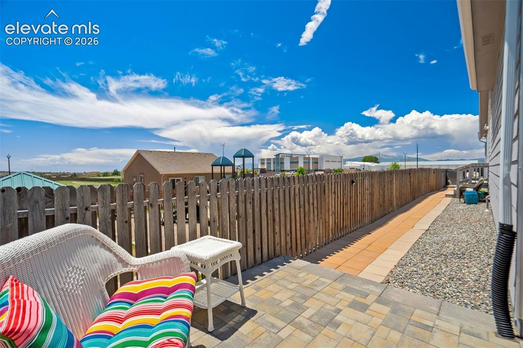 Image 36 of 43: Fully xero-scaped with pavers and rock for low maintenance.