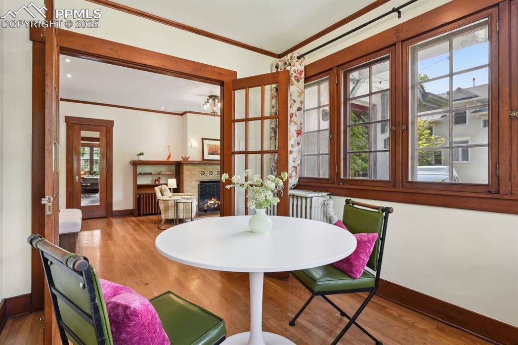 Image 12 of 49: Sunroom that could be used as a guest room, dining room, or sitting room 