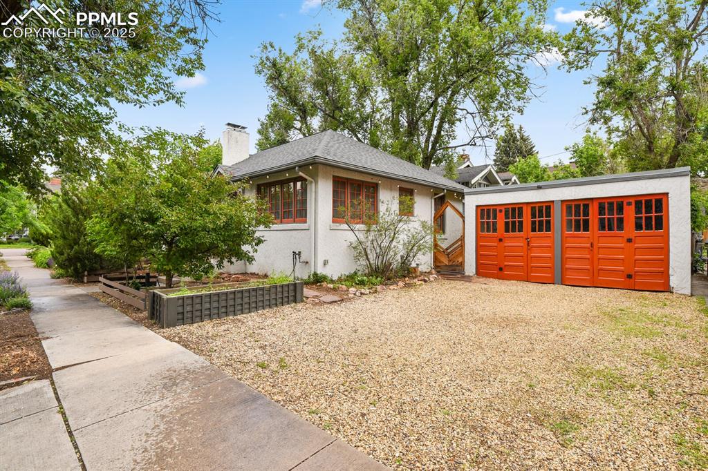Image 43 of 49: Two car deatched garage with driveway for additonal storage 