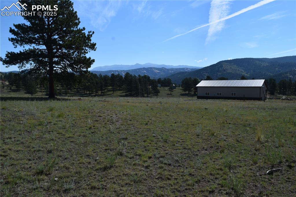 Image 35 of 44: View of mountain backdrop featuring rural landscape