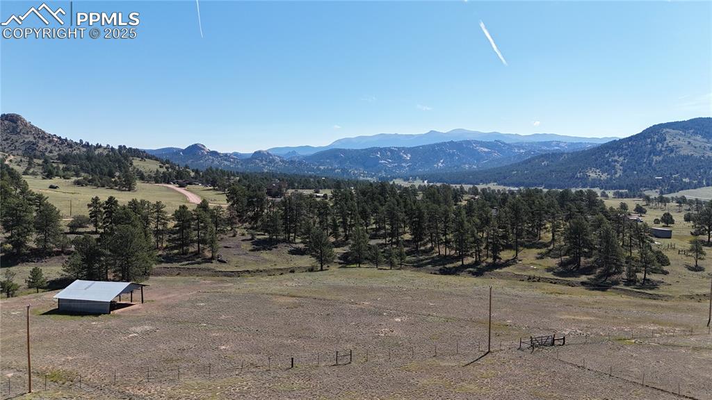 Image 4 of 44: View of mountain backdrop with rural landscape