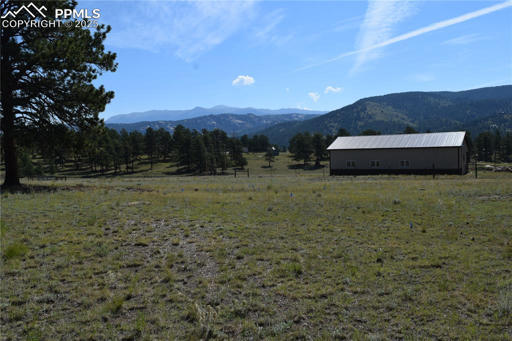 Image 44 of 44: View of mountain backdrop with rural landscape