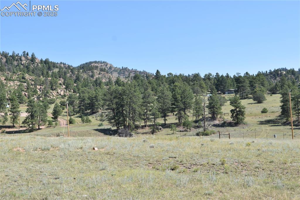 Image 7 of 44: View of mountain background featuring rural landscape