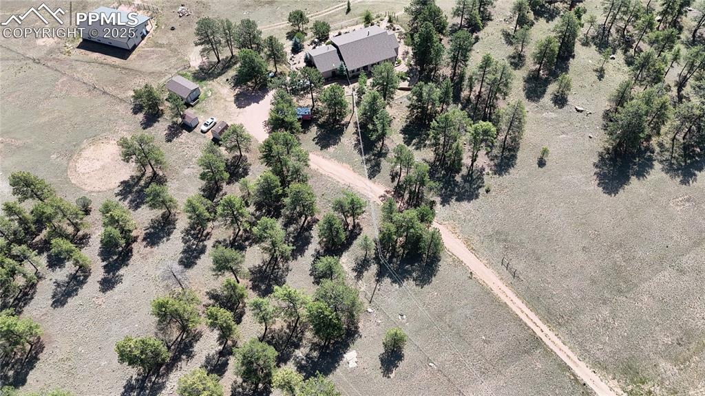 Image 8 of 44: Aerial view of property and surrounding area with rural landscape