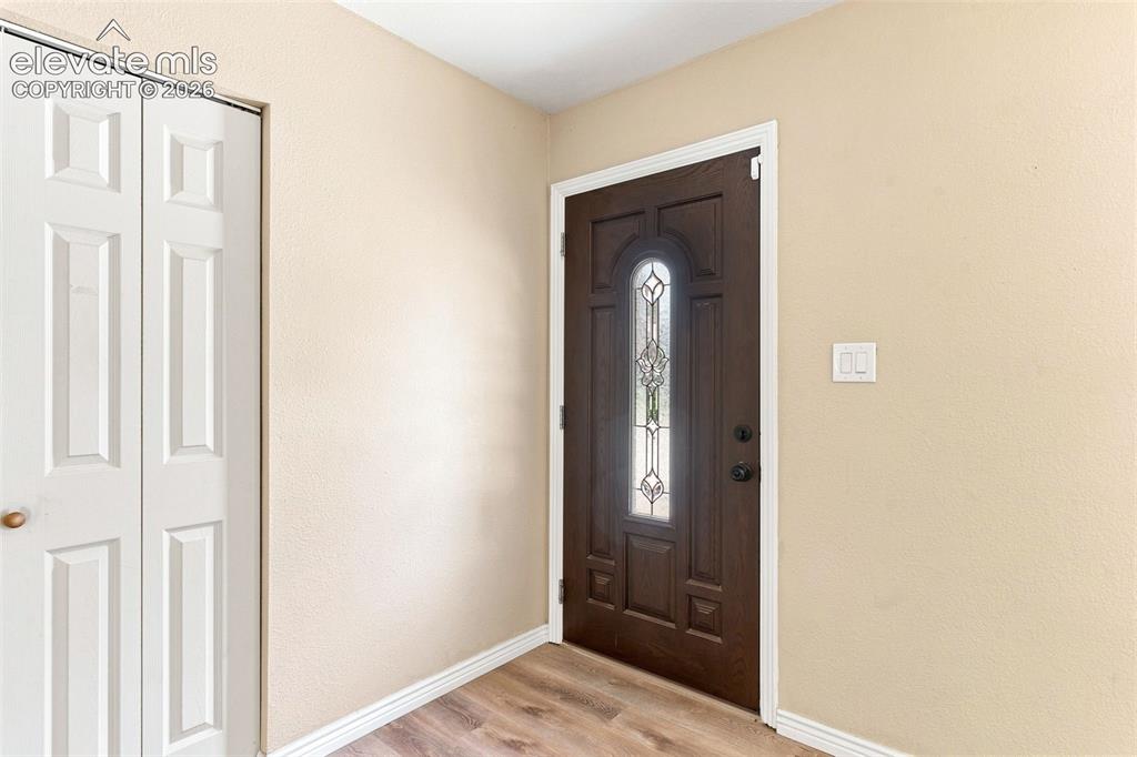 Image 2 of 39: Step inside to a wonderful open living area appointed with laminate floorin