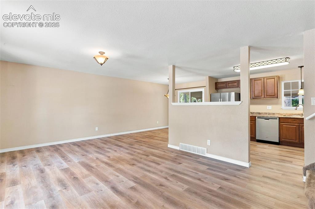 Image 5 of 39: The attractive open living area on the main level is great for everyday liv