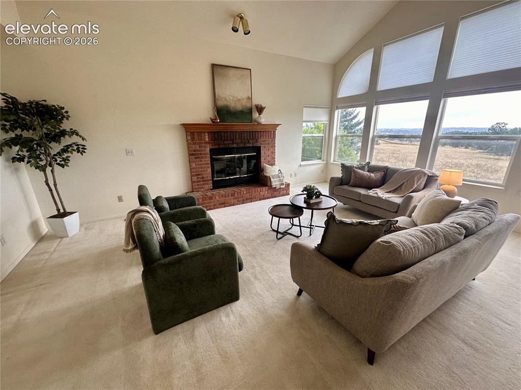 Image 10 of 50: Cozy wood fireplace in family room