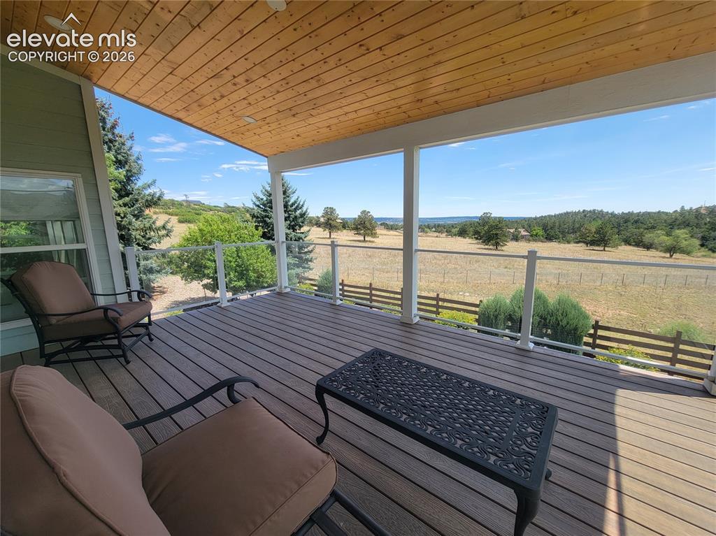Image 7 of 50: Enjoy coffee at sunrise on the covered deck