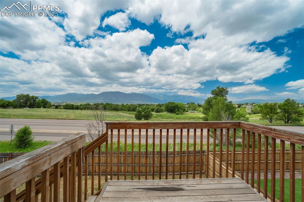 Image 13 of 44: Wooden deck with a mountain view