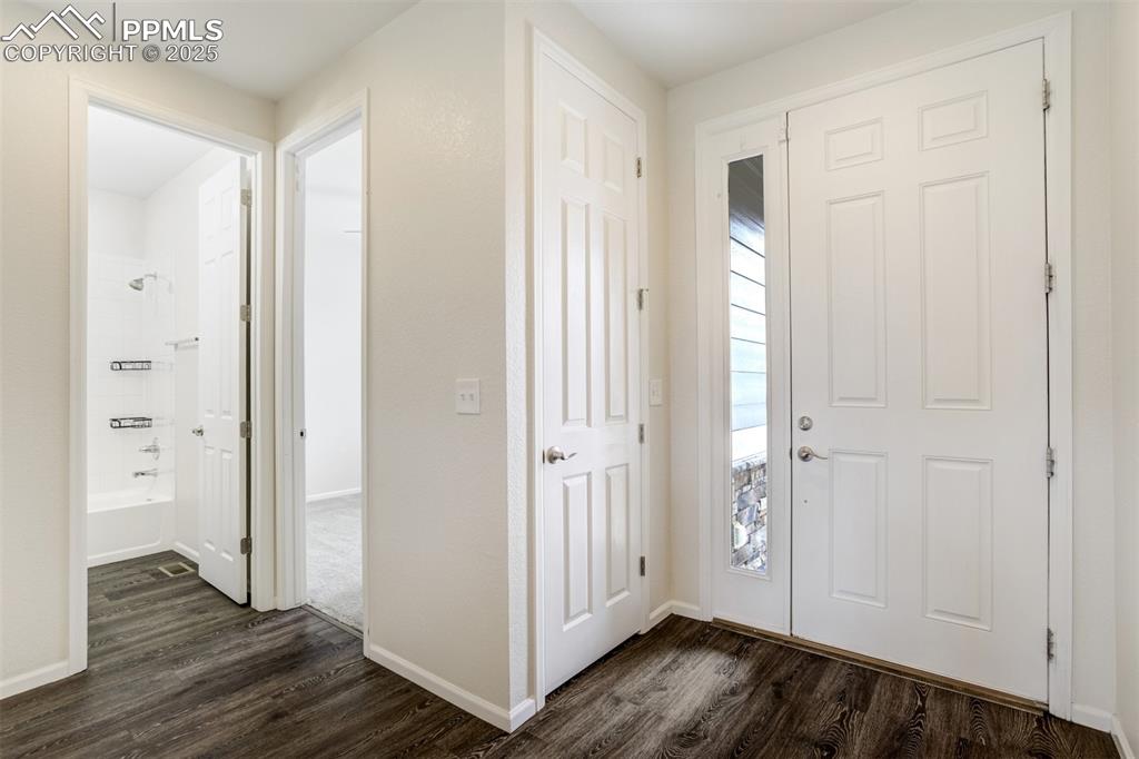 Image 14 of 44: Foyer featuring dark wood finished floors