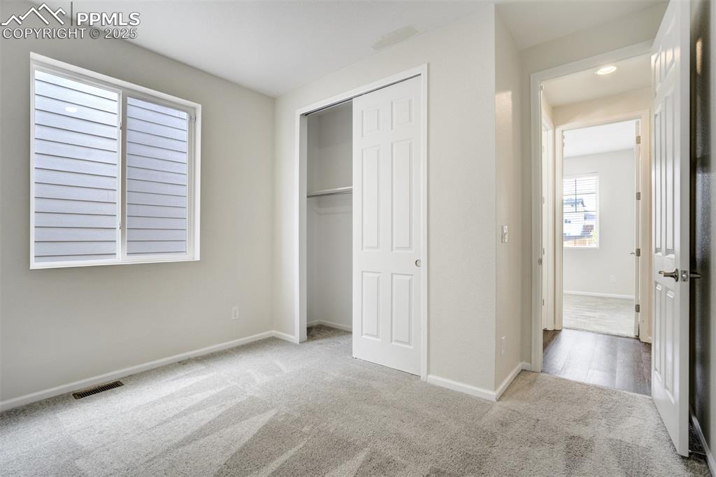 Image 17 of 44: Unfurnished bedroom featuring carpet and a closet