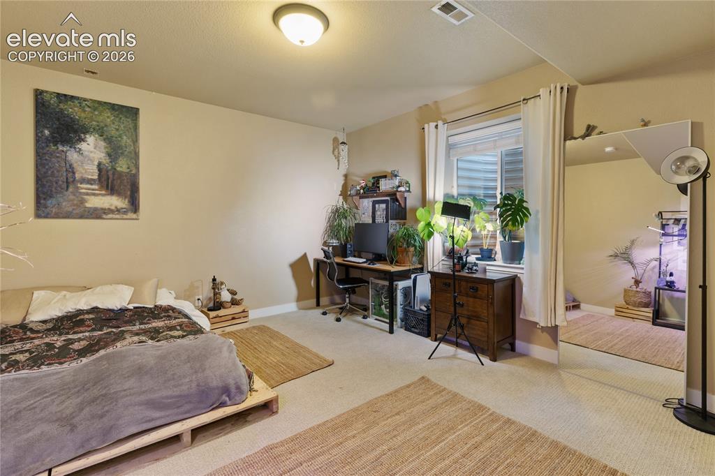 Image 24 of 29: Carpeted flooring, recessed window, and neutral wall tones