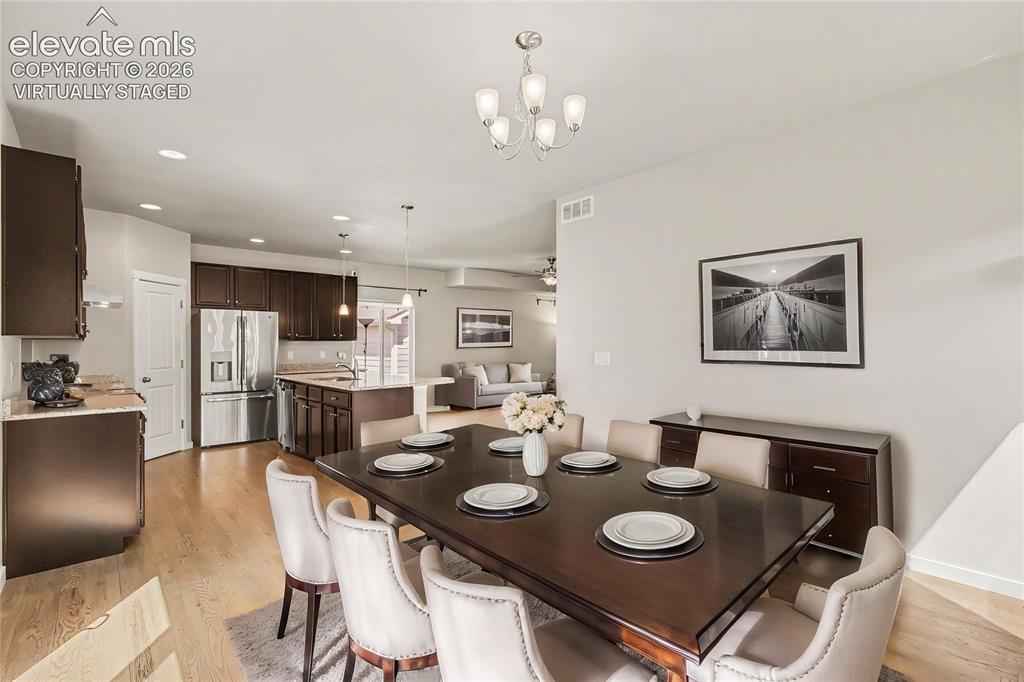 Image 14 of 39: Virtually Staged -Spacious dining area featuring recessed lighting and a co