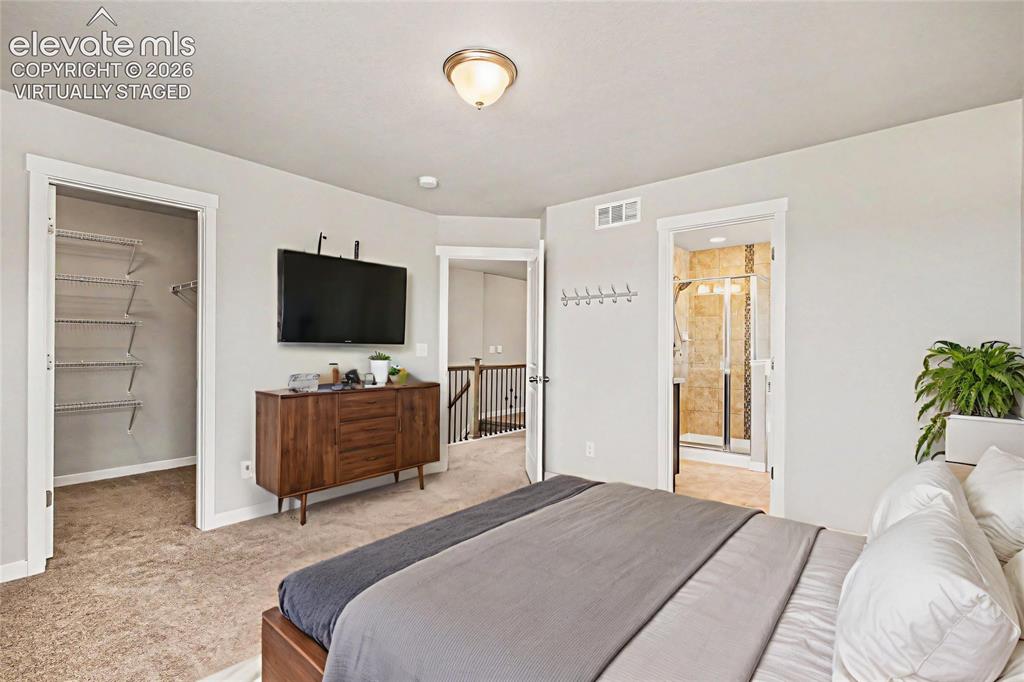Image 20 of 39: Virtually Staged - Plush carpeted bedroom featuring a ceiling light fixture