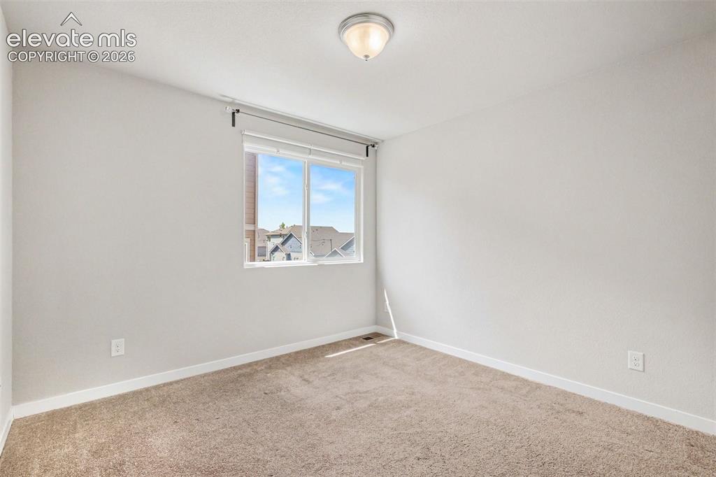 Image 25 of 39: Neutral-toned carpet flooring