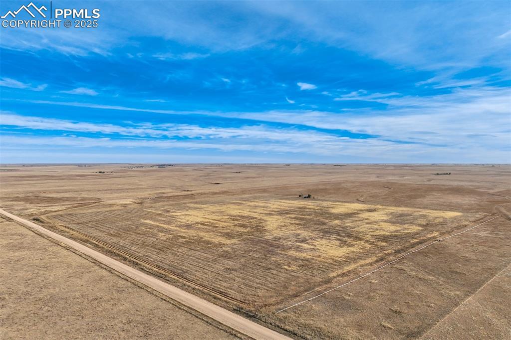 Caption: Aerial view of sparsely populated area with a desert landscape