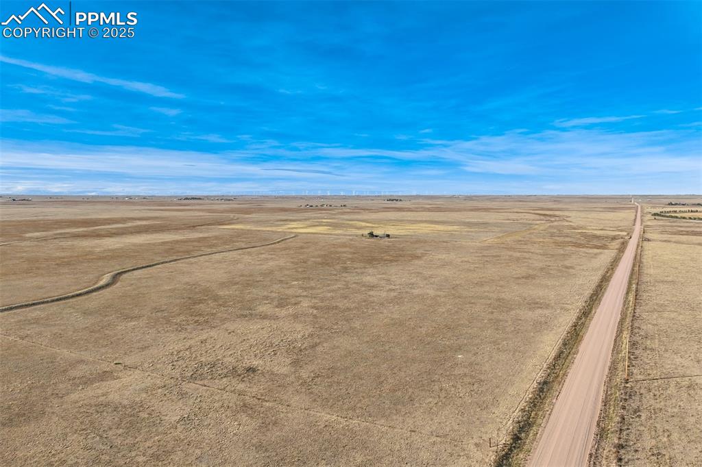 Image 11 of 25: Aerial view of sparsely populated area with a desert landscape