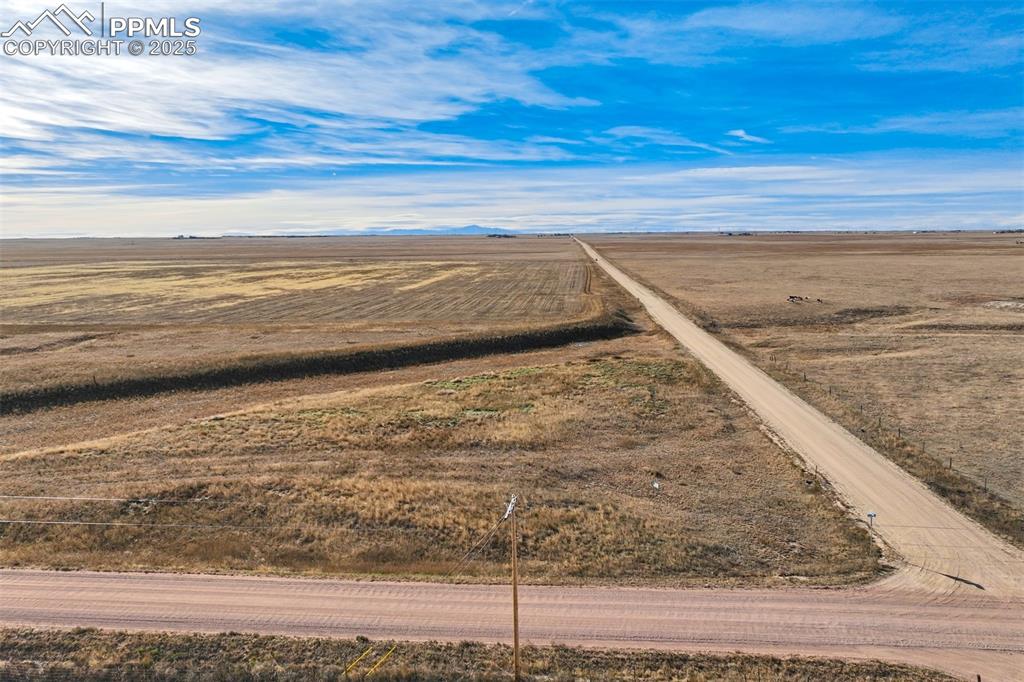 Image 8 of 25: View of rural area featuring a mountainous background