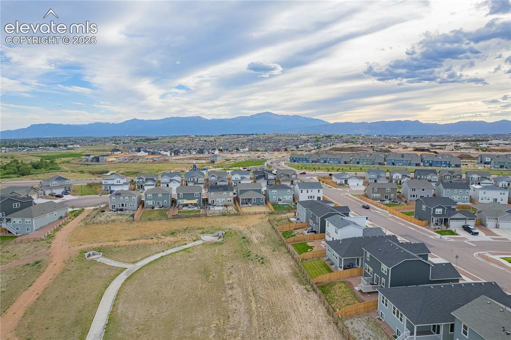 Image 28 of 30: Expansive residential development with mountain scenery