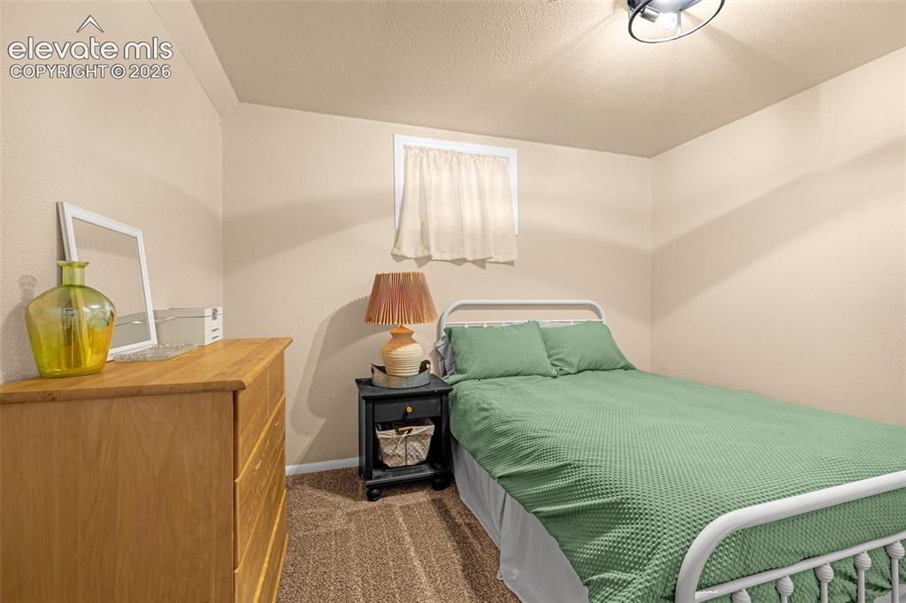 Image 14 of 27: Basement Bedroom with recessed window with white trim