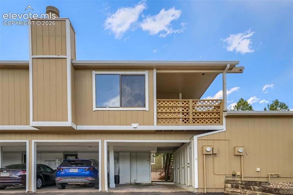 Image 1 of 10: Dedicated Carport and upper deck