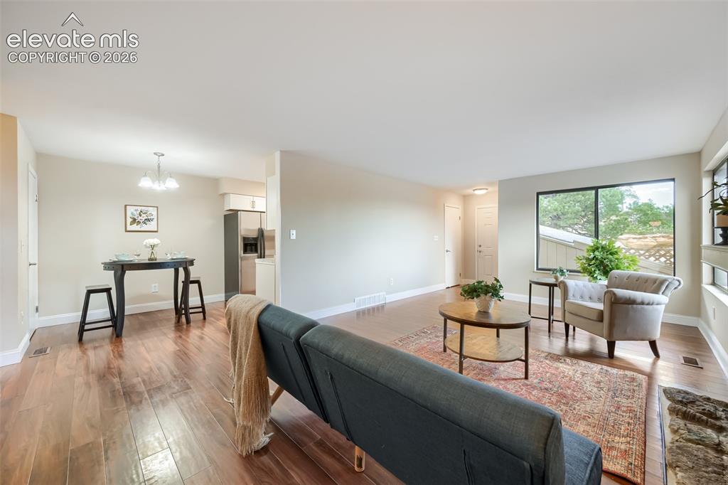 Image 4 of 10: Large living room and dining area