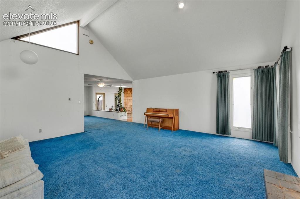 Image 10 of 50: Living room looking toward the entry