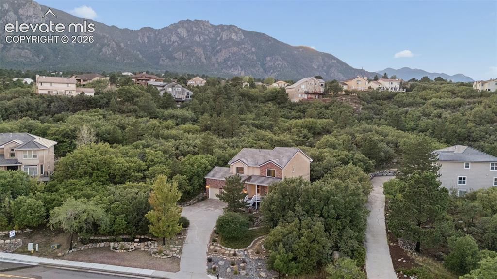 Image 41 of 47: Extensive space behind home provides a privacy buffer in back yard