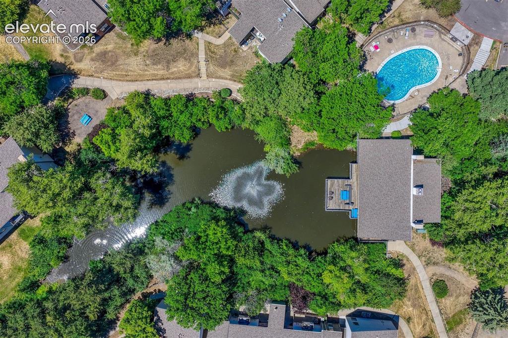 Image 24 of 35: Property featuring a private pond with a fountain, a multi-level deck over