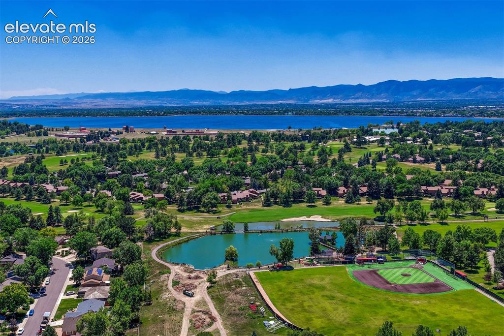 Image 27 of 35: Expansive aerial perspective showcasing a large body of water, distant moun
