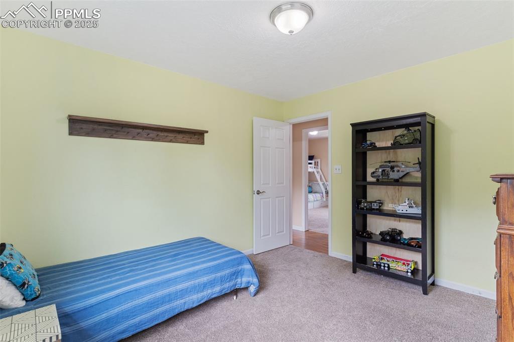Image 29 of 45: One of 4 upstairs bedrooms.