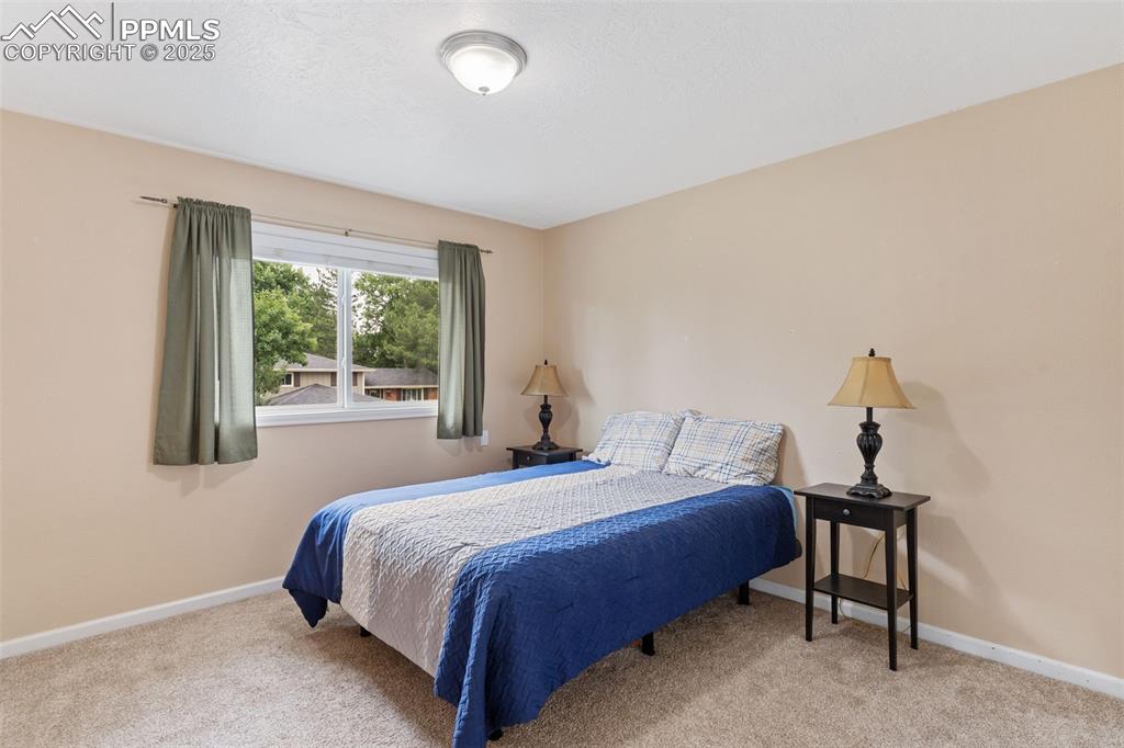 Image 30 of 45: One of 4 upstairs bedrooms.