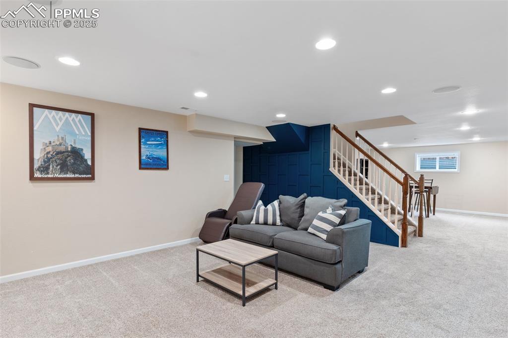 Image 35 of 45: Large, custom basement with built-ins, in-ceiling speakers for movie night!