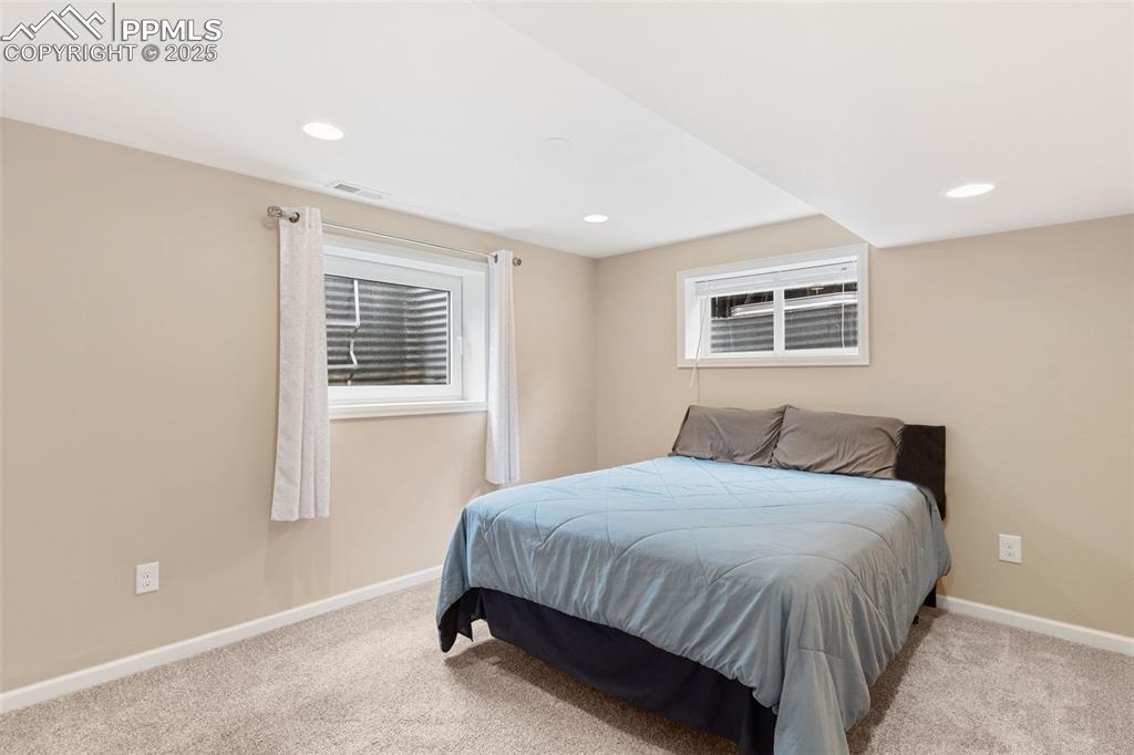 Image 40 of 45: Basement bedroom.