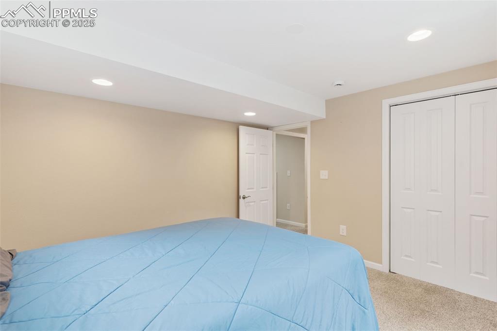 Image 41 of 45: Basement bedroom.