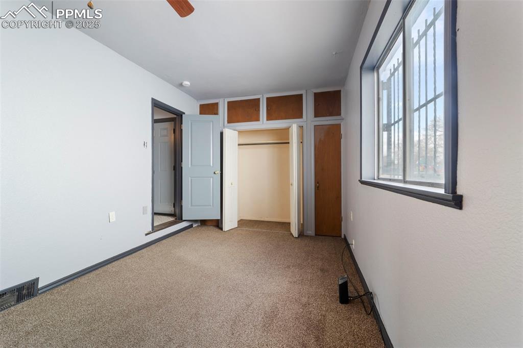 Image 27 of 41: Unfurnished bedroom featuring carpet and a ceiling fan