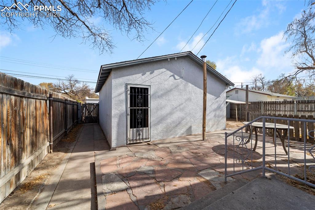 Image 33 of 41: View of outbuilding featuring a fenced backyard