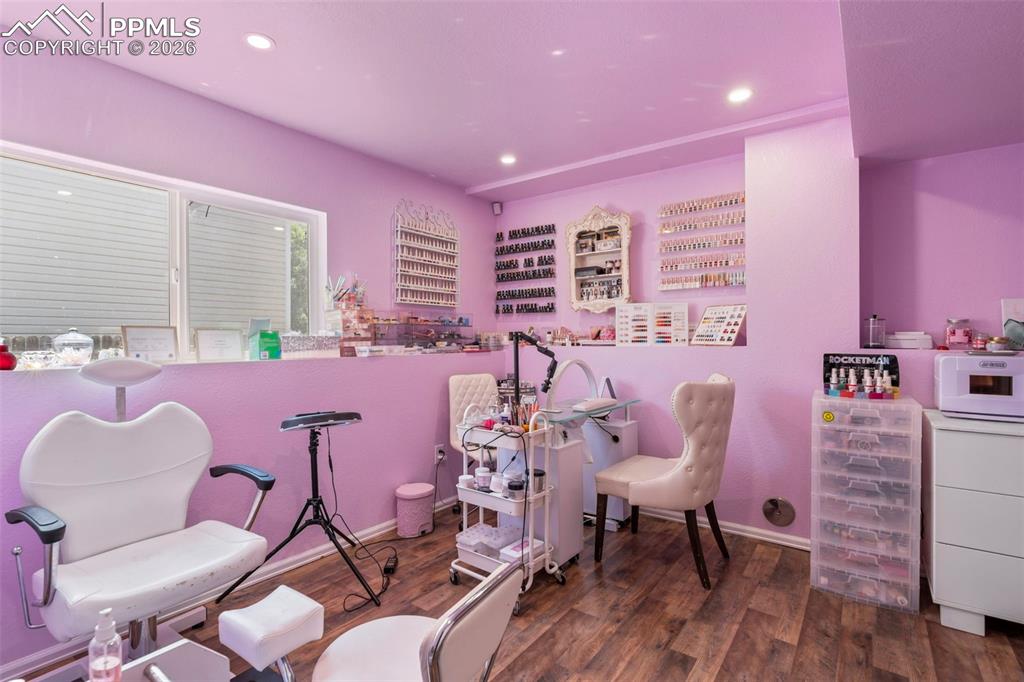 Image 22 of 25: Playroom featuring dark wood-style flooring and recessed lighting
