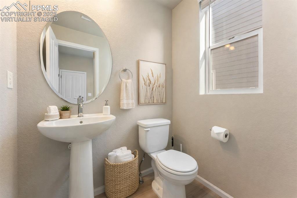 Image 28 of 38: Virtually Staged Main Floor Half Bath